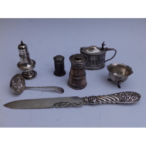 100 - A Birmingham silver-handled bread knife, a sugar sifter and five silver condiment pieces. (7)