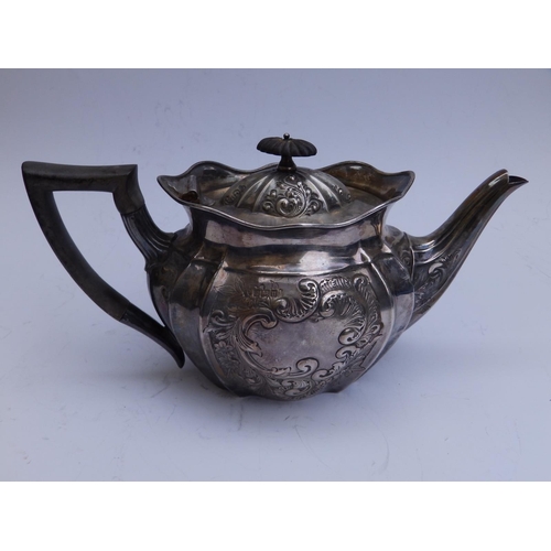 101 - An Edwardian embossed oval silver teapot -  Sheffield 1905, 10.75