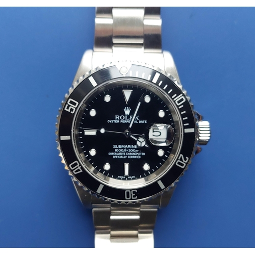 121 - A 2002  gent's stainless steel Rolex Submariner Oyster Perpetual Date wrist watch, the black dial wi... 