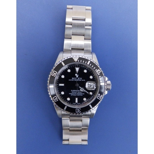 121 - A 2002  gent's stainless steel Rolex Submariner Oyster Perpetual Date wrist watch, the black dial wi... 