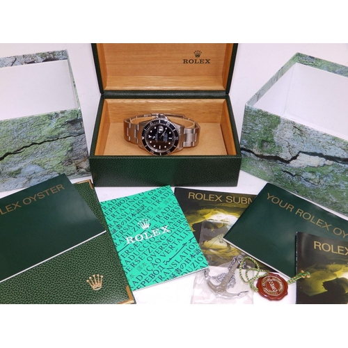 121 - A 2002  gent's stainless steel Rolex Submariner Oyster Perpetual Date wrist watch, the black dial wi... 