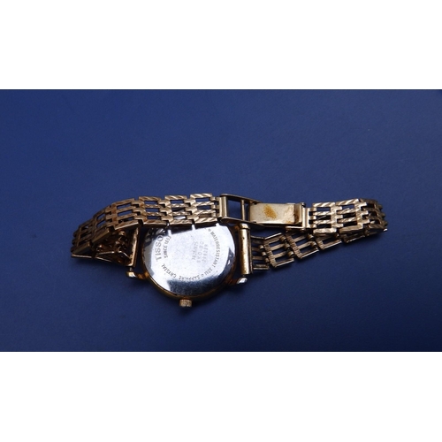 129 - A  ladies gold plated Tissot wrist watch having white dial with Roman numerals, date indicator, case... 