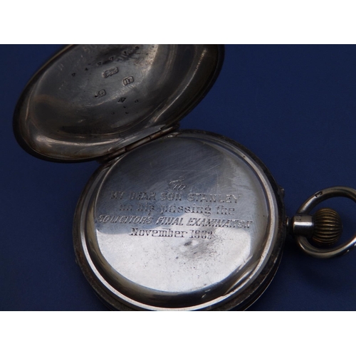 132 - A silver half hunter cased  presentation pocket watch,  50mm diameter and a (damaged)  trench style ... 