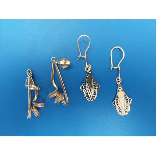 144 - A pair of 9ct gold drop earrings and one other pair. (4)