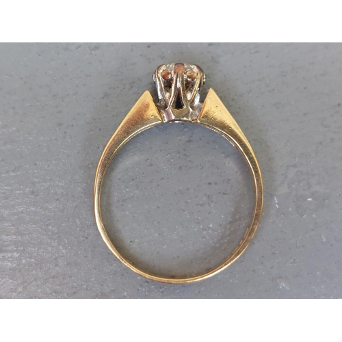 153 - A small illusion set diamond solitaire, small diamonds to shoulders on 9ct gold shank.  Finger size ... 