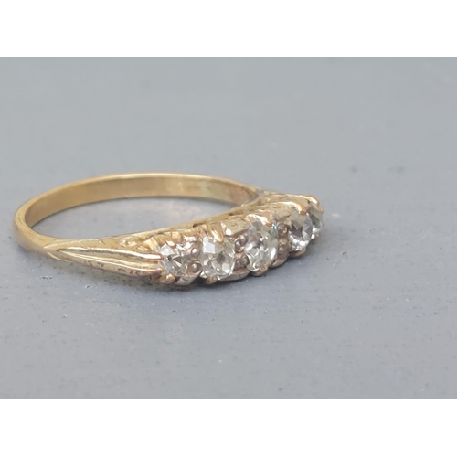 154 - A graduated five stone old cut diamond ring on yellow metal shank.  Finger size N.