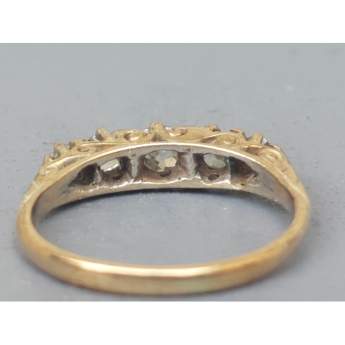 154 - A graduated five stone old cut diamond ring on yellow metal shank.  Finger size N.