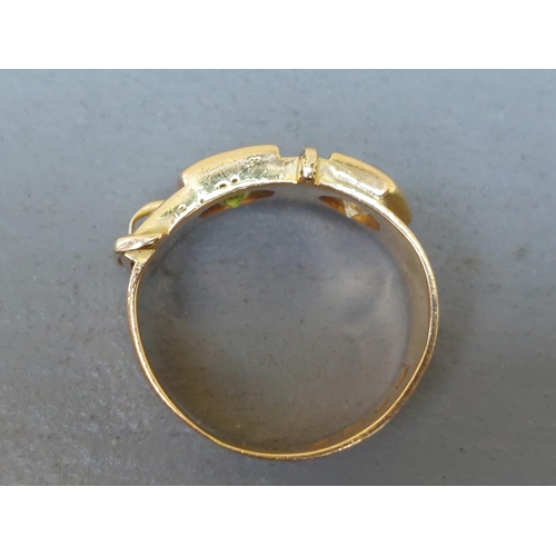 159 - A diamond & green stone set 18ct gold buckle band ring - London marks 1951.  Finger size N/O.