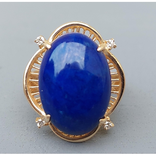 160 - A 14ct gold dress ring set with a lapis cabochon and four small diamonds.  Finger size M.