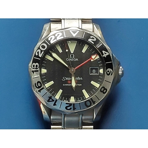 124 - A boxed gent's stainless steel Omega Seamaster GMT Chronometer bracelet wrist watch with black dial,... 