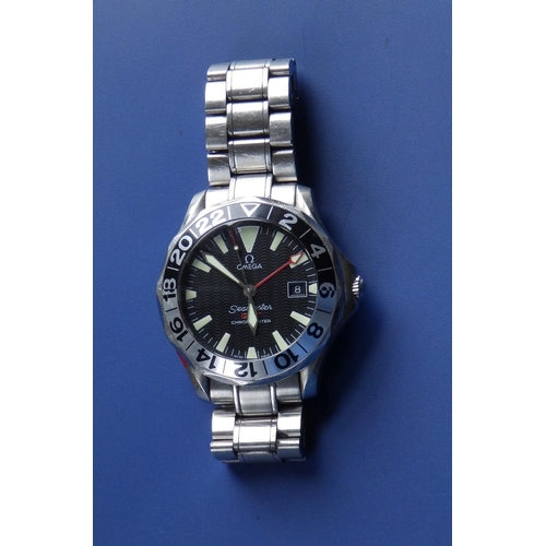 124 - A boxed gent's stainless steel Omega Seamaster GMT Chronometer bracelet wrist watch with black dial,... 