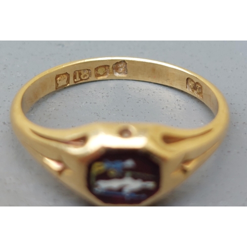 163 - A late Georgian 18ct gold signet style ring, set with a small octagonal red stone decorated with ena... 