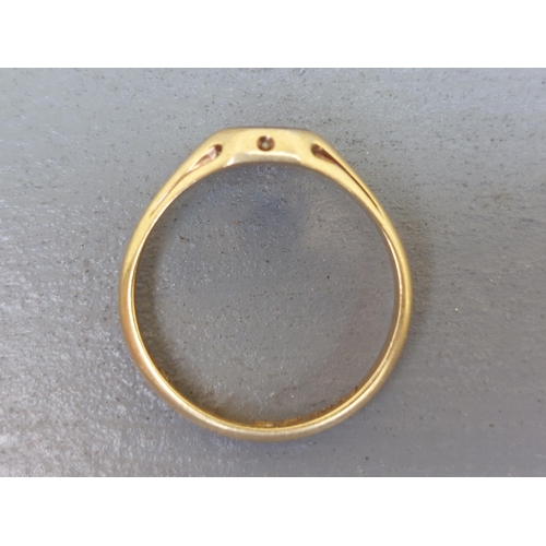 163 - A late Georgian 18ct gold signet style ring, set with a small octagonal red stone decorated with ena... 