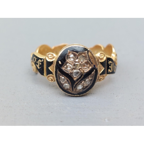 164 - A Victorian black enamelled memoriam ring, a the front with hinged cover set rose cut diamonds, encl... 