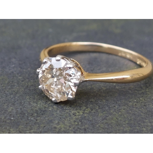 165 - A diamond solitaire ring, the claw set brilliant weighing in excess of one carat, on '18ct' shank.  ... 