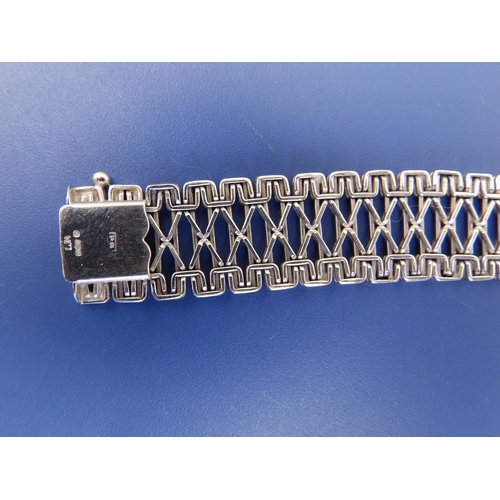 196 - An 18ct white gold openwork bracelet - clasp repaired, 7.25