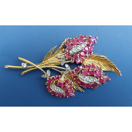 197 - A modern ruby & diamond set yellow metal flower spray brooch, 2.5