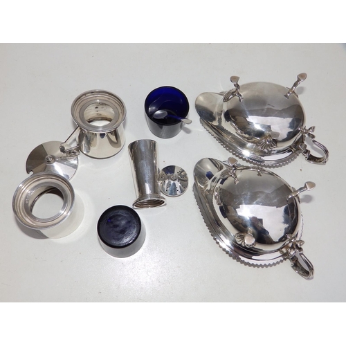 106 - A pair of Birmingham silver sauceboats and a three piece silver condiment set. (5)