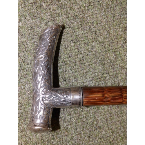 87 - A Chinese silver-handled umbrella with Exeter inscription.