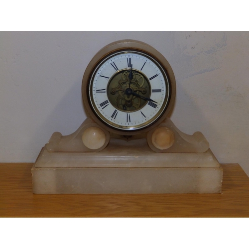 87b - A 19thC white onyx mantel clock, 9