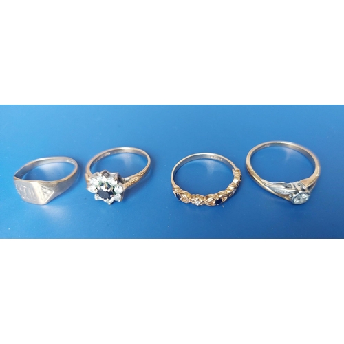 143 - A diamond solitaire ring and three 9ct rings. (4)