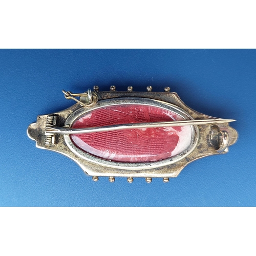 171 - A 19thC memoriam brooch, set with small rubies and a diamond, the glazed compartment to reverse cont... 