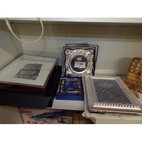 282 - ALL SILVER PLATED PICTURE FRAMES ON SHELF