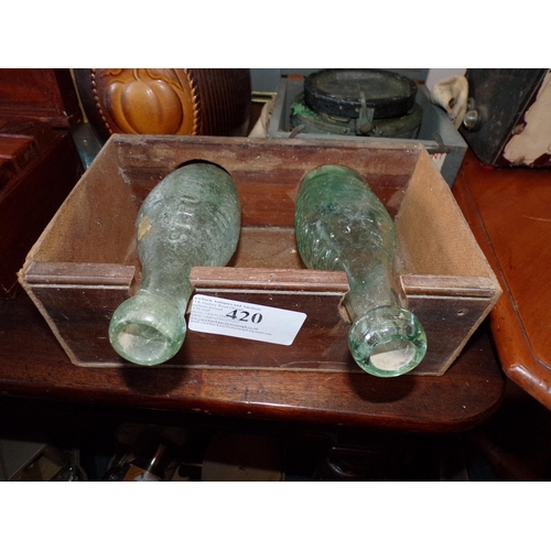 420 - PAIR CODD'S PATENT BOTTLES IN TABLE HOLDER