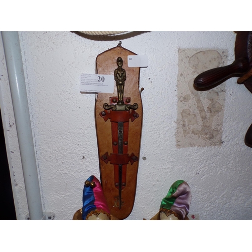 20 - ORNATE SWORD ON LEATHER WALL MOUNT