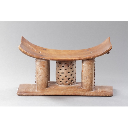 607 - AN OLD EXAMPLE OF AN ASHANTI STOOL GHANA, 19TH CENTURY 32cm high, 54.5cm wide Together with another ... 