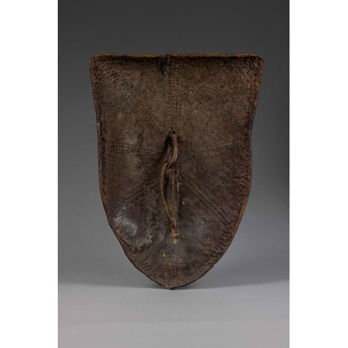 608 - A WORKED LEATHER TRIBAL SHIELD KENYAN, 19TH CENTURY 91.5cm high, 60.5cm wide