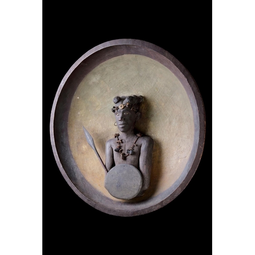 622 - A RARE MADAGASCAN SOUTHERN SAKALAVA PEOPLES PLAQUE EARLY 20TH CENTURYDepicting a warrior with spear ... 