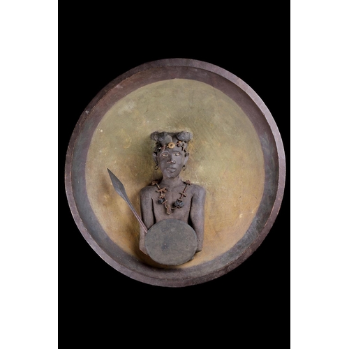 622 - A RARE MADAGASCAN SOUTHERN SAKALAVA PEOPLES PLAQUE EARLY 20TH CENTURYDepicting a warrior with spear ... 