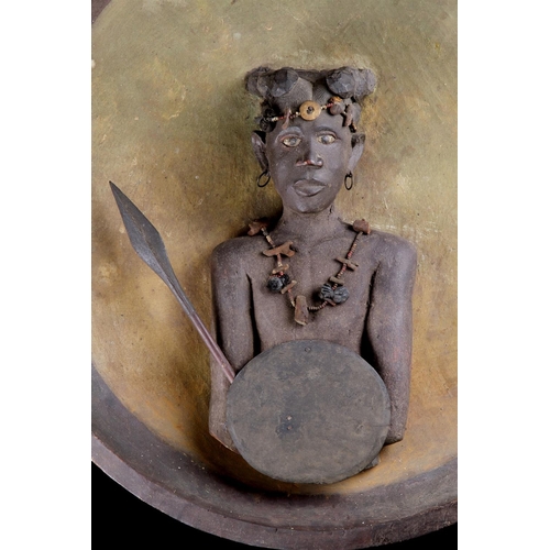 622 - A RARE MADAGASCAN SOUTHERN SAKALAVA PEOPLES PLAQUE EARLY 20TH CENTURYDepicting a warrior with spear ... 