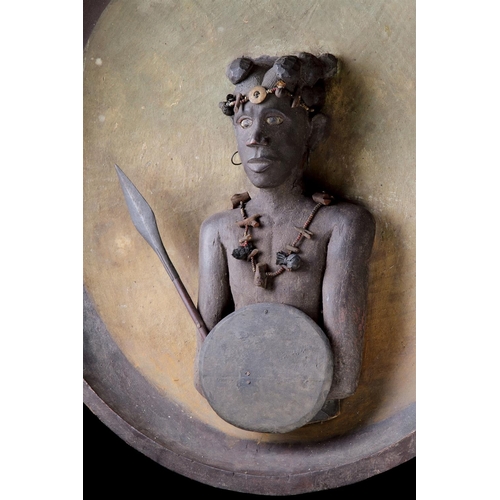 622 - A RARE MADAGASCAN SOUTHERN SAKALAVA PEOPLES PLAQUE EARLY 20TH CENTURYDepicting a warrior with spear ... 