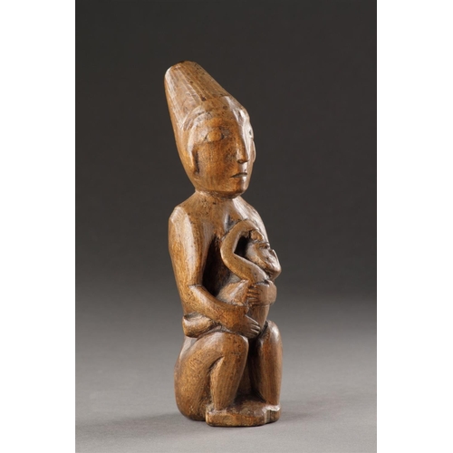 629 - A RARE AND EARLY NORTHWEST COAST CARVED WOOD MATERNITY FIGURE KWAKIUTL (KWAKWAKA 'WAKW'), 19TH CENTU... 