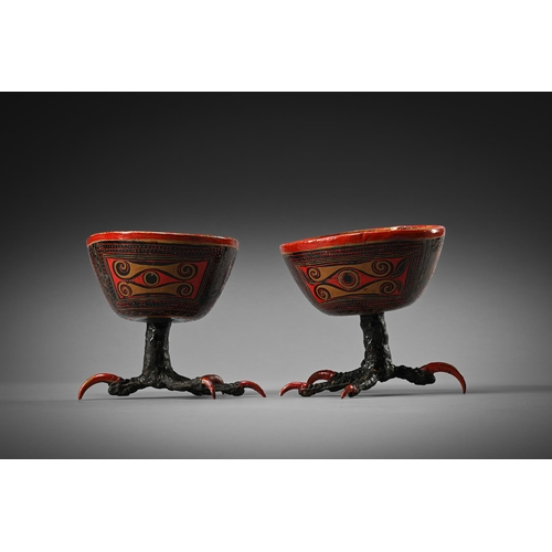 635 - AN UNUSUAL PAIR OF SOUTH AMERICAN LACQUERED GOURD BOWLS POSSIBLY PERU, EARLY 20TH CENTURY Raised upo... 