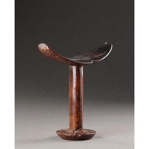 639 - A FINELY CARVED 'BONI' NECK-REST SOMALIA, 19TH CENTURY Dark colour and patination through extended u... 