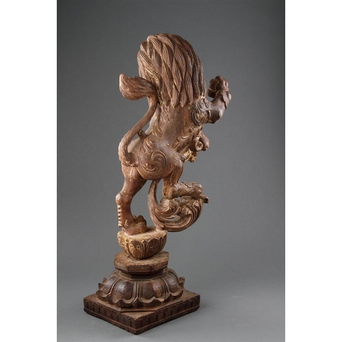 645 - A GOOD PAIR OF ANGLO-INDIAN CARVED WOOD RAMPANT LIONS MID 19TH CENTURY Wood, polychrome, and gilt, b... 