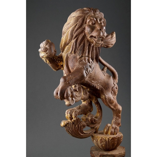 645 - A GOOD PAIR OF ANGLO-INDIAN CARVED WOOD RAMPANT LIONS MID 19TH CENTURY Wood, polychrome, and gilt, b... 