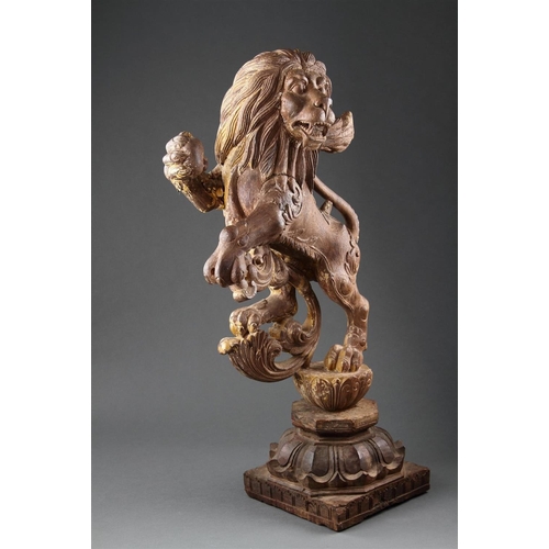 645 - A GOOD PAIR OF ANGLO-INDIAN CARVED WOOD RAMPANT LIONS MID 19TH CENTURY Wood, polychrome, and gilt, b... 