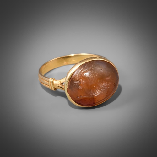 648 - A CORNELIAN INTAGLIO RING POSSIBLY 3-5TH CENTURY The intaglio possibly Roman or further East, with a... 