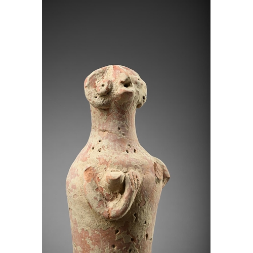 658 - ANTIQUITIES TO INCLUDE: A a standing stylised pottery figure, 29cm high  A collection of Roman and l... 