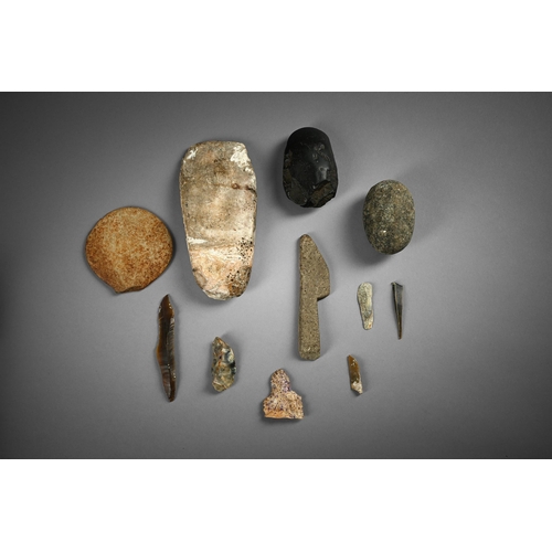 662 - A COLLECTION OF STONE TOOLS TO INCLUDE: Large flint axe head, possibly Neolithic, 20.5cm long Black ... 