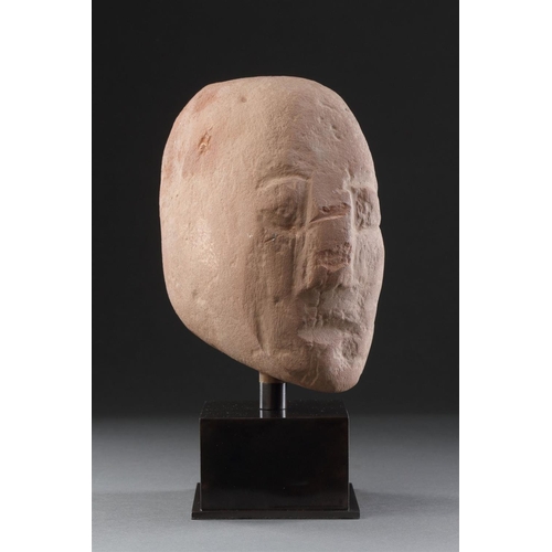 665 - AN ANCIENT BRITISH CELTIC RED SANDSTONE HEAD 1ST CENTURY BC-1ST CENTURY AD Of unusual shape with a l... 