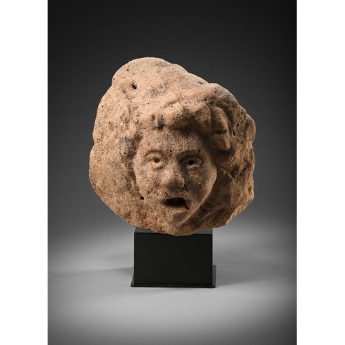 679 - A MEDIEVAL STONE HEAD OF A SINGING FIGURE 14TH/15TH CENTURY With deeply pierced eyes, perhaps once i... 