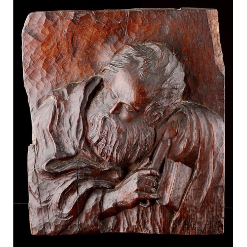 681 - A FINELY CARVED OAK HIGH RELIEF OF ST JOHN 17TH CENTURY Of good colour and patina, depicted holding ... 