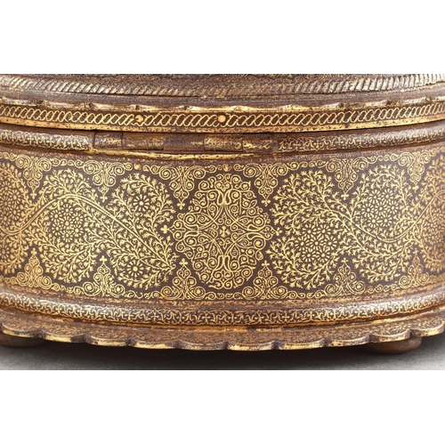 712 - AN INDIAN RAJASTHAN IRON CASKET DECORATED WITH GOLD DAMASCENE MID 19TH CENTURY Of oval form with fol... 