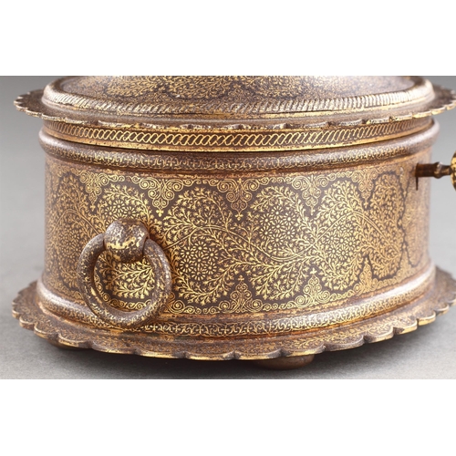 712 - AN INDIAN RAJASTHAN IRON CASKET DECORATED WITH GOLD DAMASCENE MID 19TH CENTURY Of oval form with fol... 