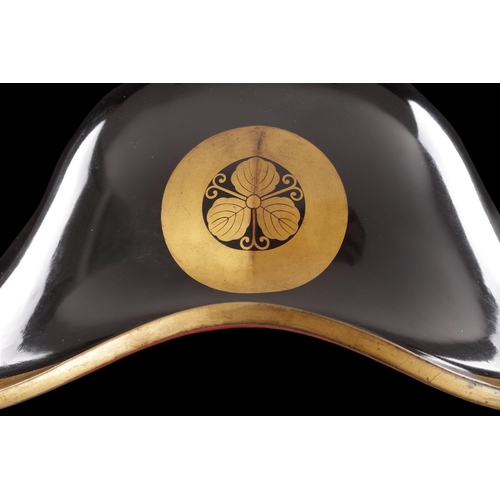 720 - A GOOD JAPANESE JINGASA HELMET CIRCA 1750-1850 Black Lacquer with a gold rim and 'Mon' in the shape ... 